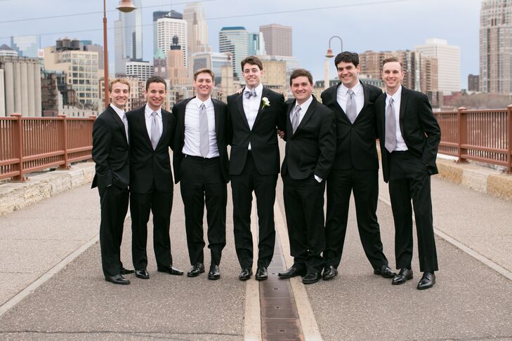Leigh chose a black Hugo Boss tux with a silver bow tie while the groomsmen donned similar black Calvin Klein tuxes.