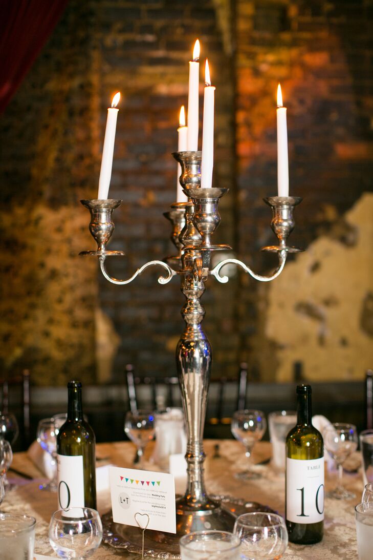 "We wanted to spend the bulk of our budget on the band, an open bar and delicious food, so we opted for candles, white twinkle lights and other creative lighting in lieu of flowers," Taylor says.