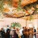 Guests at WEdding Reception With Rustic Antler Chandeliers