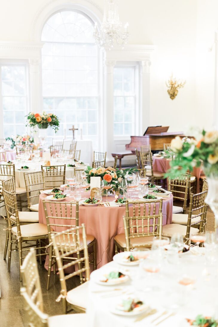 After the ceremony, the drawing room was converted to seating for the Southern-infused dinner. Peach table linens, gold chiavari chairs and alternating centerpieces gave the room a romantic, elegant feel.