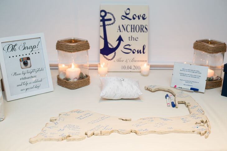 Instead of having their guests sign a traditional guest book, the couple had their family and friends write their well wishes on a wooden plaque in the shape of Cape Cod.