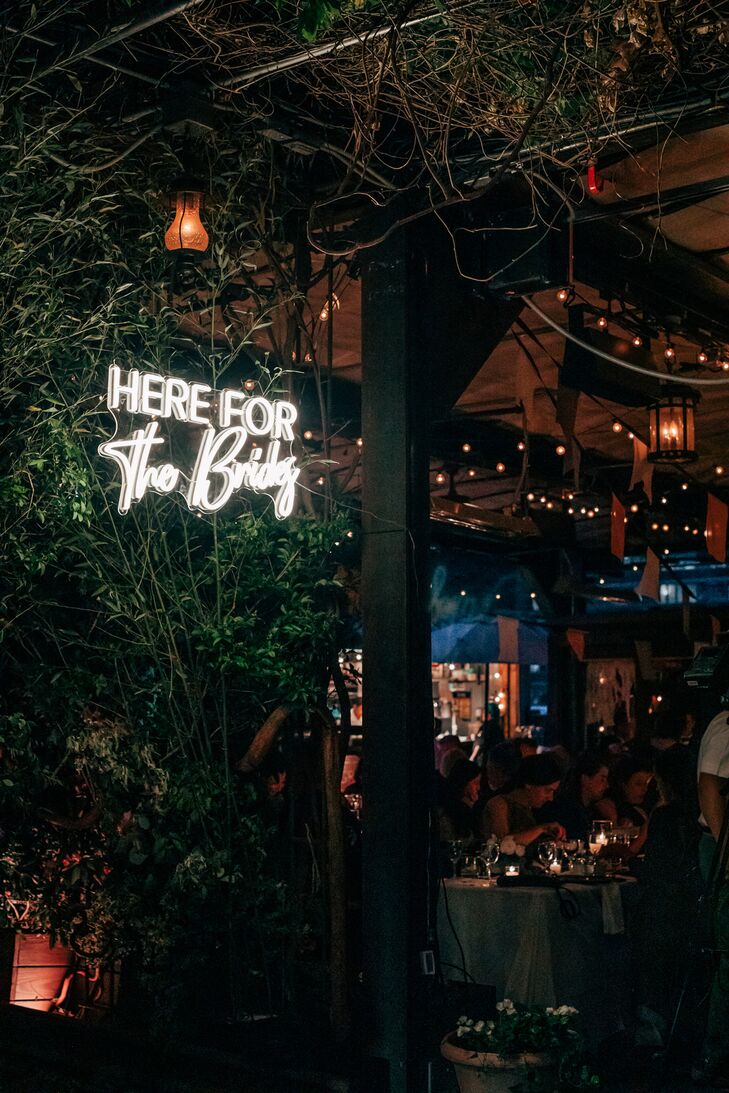 Custom Neon Sign for Two Brides Personalized for an LGBTQ+ Wedding at Low-Light Hotel Venue