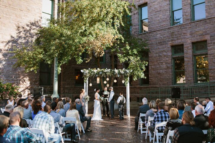 Outdoor Ceremony and Greenery-Adorned Wedding Arch