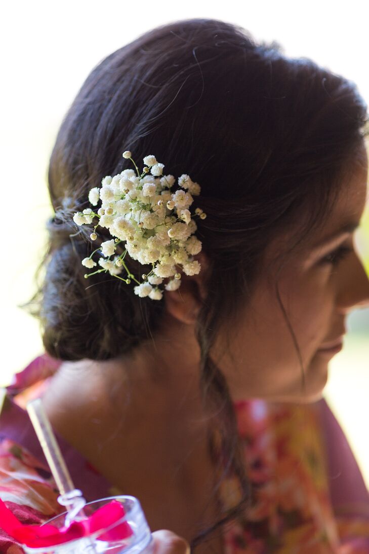 The bridesmaids wore their hair in updos accented with baby’s breath.