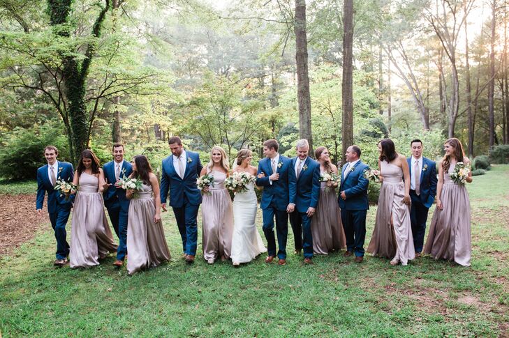 "The garden was so beautiful in its raw state that we barely needed to add any decor," Allie Beth says. "The chairs were dark brown, nicely matching the natural scenery. Petals were lightly strewed down the aisle. The brick garden walls hold metal urns—we filled them with ferns. But my favorite part of the ceremony decor was the wooden cross at the altar. My husband and his dad made this cross by hand in the months before our wedding."