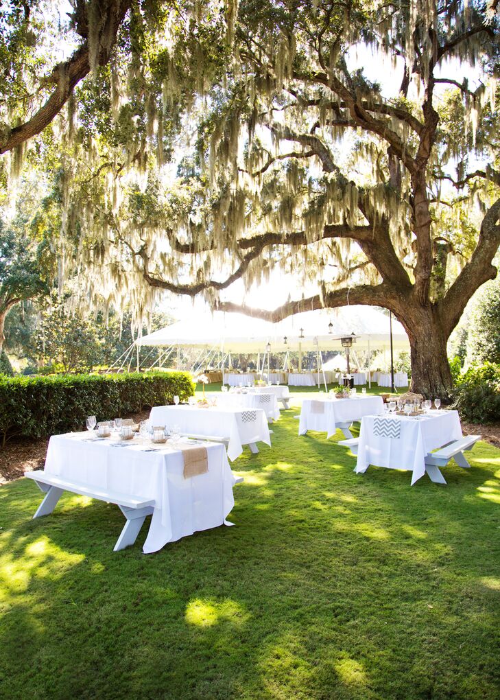 The couple wanted to keep things casual. For a rustic flair, they combined burlap with chevron table runners and hung lanterns from the oak trees, which was the bride’s favorite décor piece.