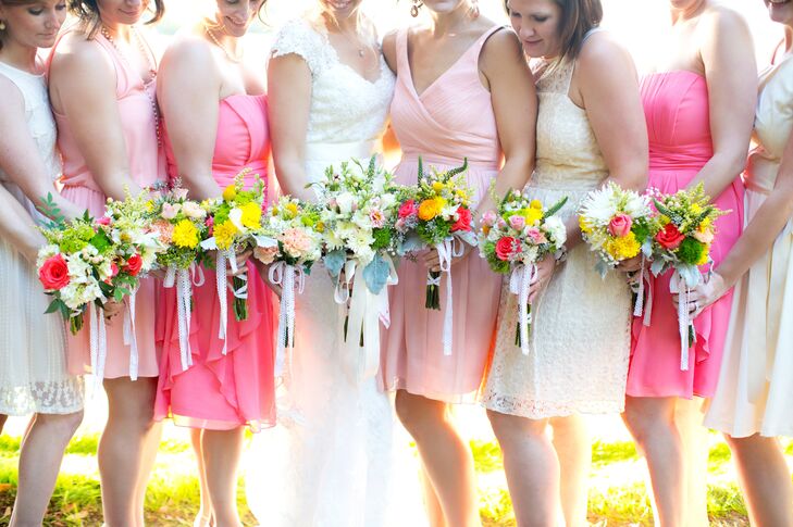 The bridesmaids put together their own bouquets after the bridesmaid’s luncheon.  "My mom, our  florist, had tons of flowers in buckets and the girls selected and arranged the flowers they wanted to include," says Amalie. "My mom and her talented friends helped the girls secure their bouquets and tie the stems with raffia."