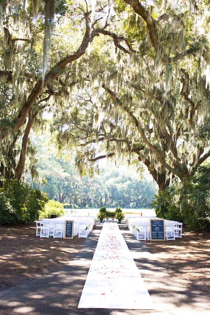 The ceremony took place in a space that Caledonia calls Azalea Row under a “hallway” of live oak trees with Spanish moss hanging down.