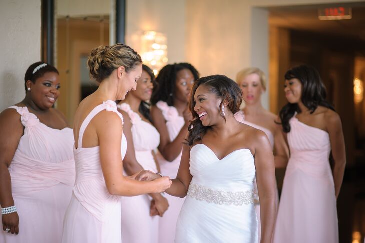 Each of Chantel's bridesmaids wore a pale pink floor-length one-shoulder dress and carried a white hydrangea bouquet.