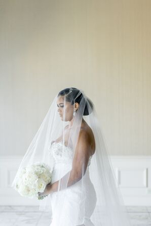 Bride With Long Veil Over Her Face Holding All-White Bouquet