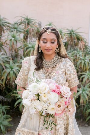 Bride With Traditional Gold Indian Jewelry and Gold Lehenga