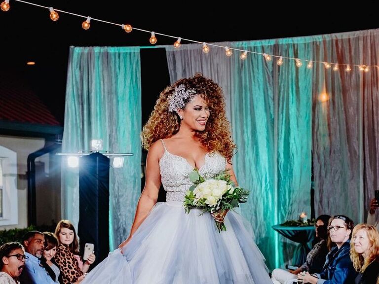 Bride wears her hair loose and natural for her wedding day. 