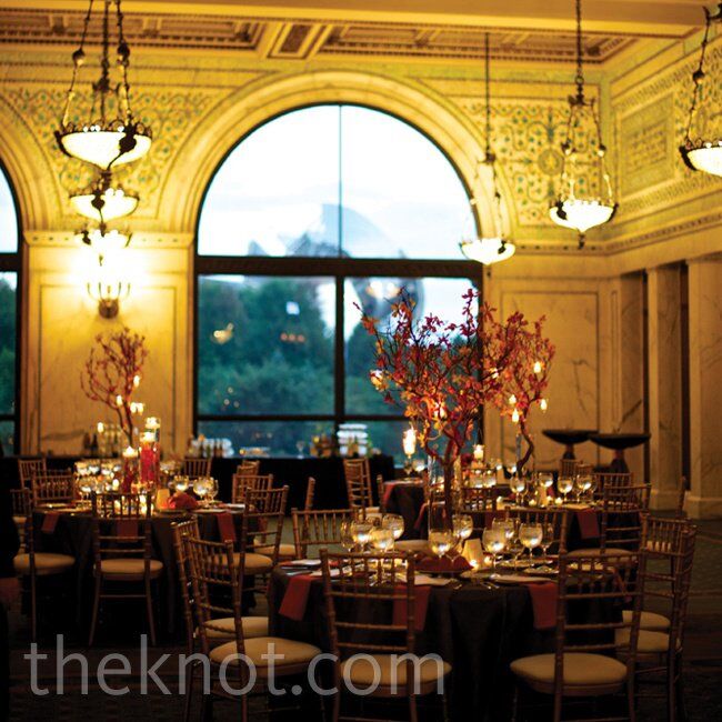 Some of the dinner tables got a boost in height from tall manzanita branches covered in orange orchid blooms and hanging candles.
