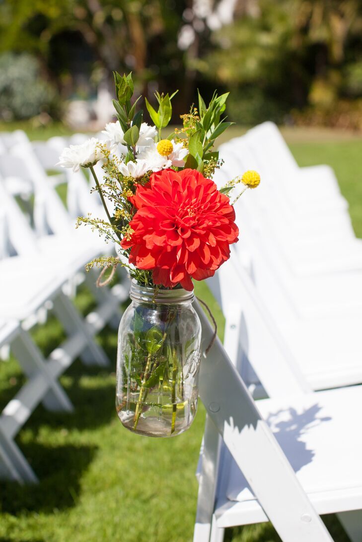 "We worked with the theme of vintage-rustic-bohemian and a color scheme base of gray and yellow," Sarah says. The wildflowers on the white folding chairs and the vintage Spanish tiles in the county courthouse added vibrant color to the celebration.