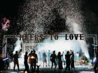 Guests on dance floor with confetti and fog machines