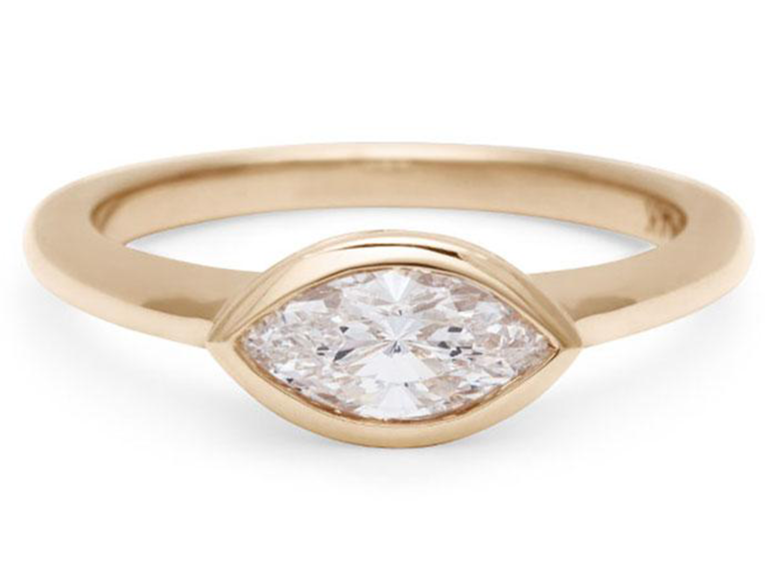 Marquise cut diamond center on yellow gold band