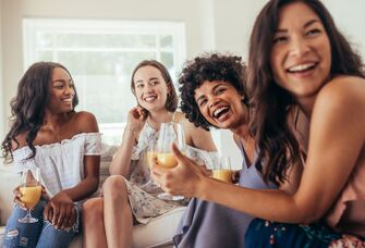 Group of girl friends playng games at bachelorette party