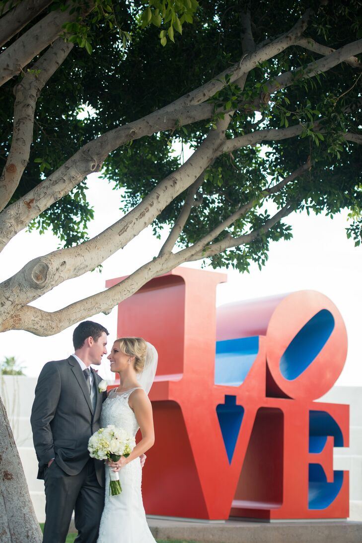 Ryan wore a dark charcoal suit, silver vest and a dark gray tie with a white rose boutonniere. His groomsmen wore light aqua neckties to match the bridesmaids.