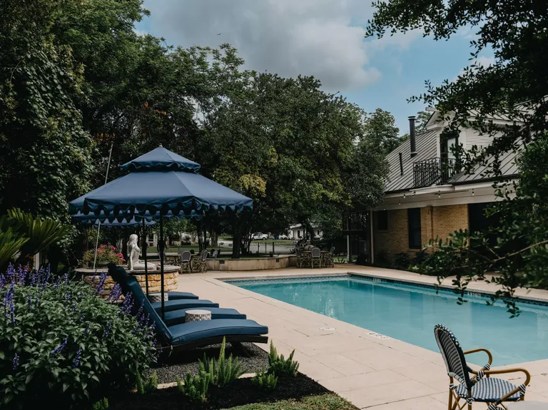 Outdoor reception space with pool at Sophie's Gasthaus small wedding venue in central texas