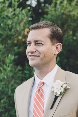 Groom in a Coral Tie and White Boutonniere