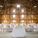 Crisp white linens and gold chiavari chairs decorated the round reception tables.