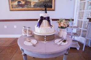 White Wedding Cake on Burlap Stand