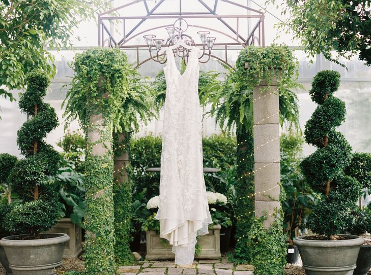 Lauren’s wedding dress from Allure Couture couldn’t have been a better fit for her style and venue. The flowers on the lace went so well with the flowers throughout the venue, and all of the crystal accents and pearls sparkled in the candlelight.