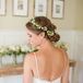 Sarah wanted a romantic look for her hair--she chose a loose updo complemented by a flower crown for a rustic, romantic touch.