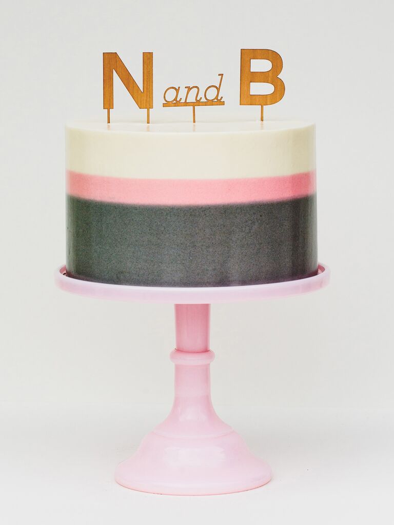 One-tier pink and white and gray bridal shower cake with monogram cake topper