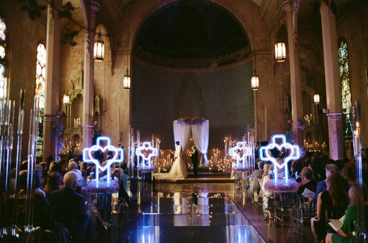 Ceremony in a Church Setting With Neon Heart Crucifixes, Low Lighting