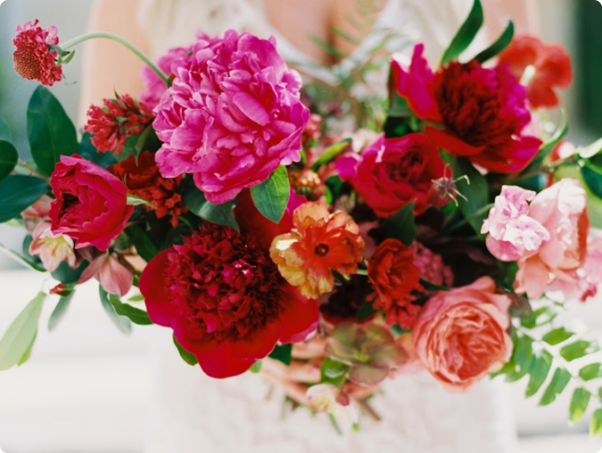 A large bouquet of red and pink flowers.