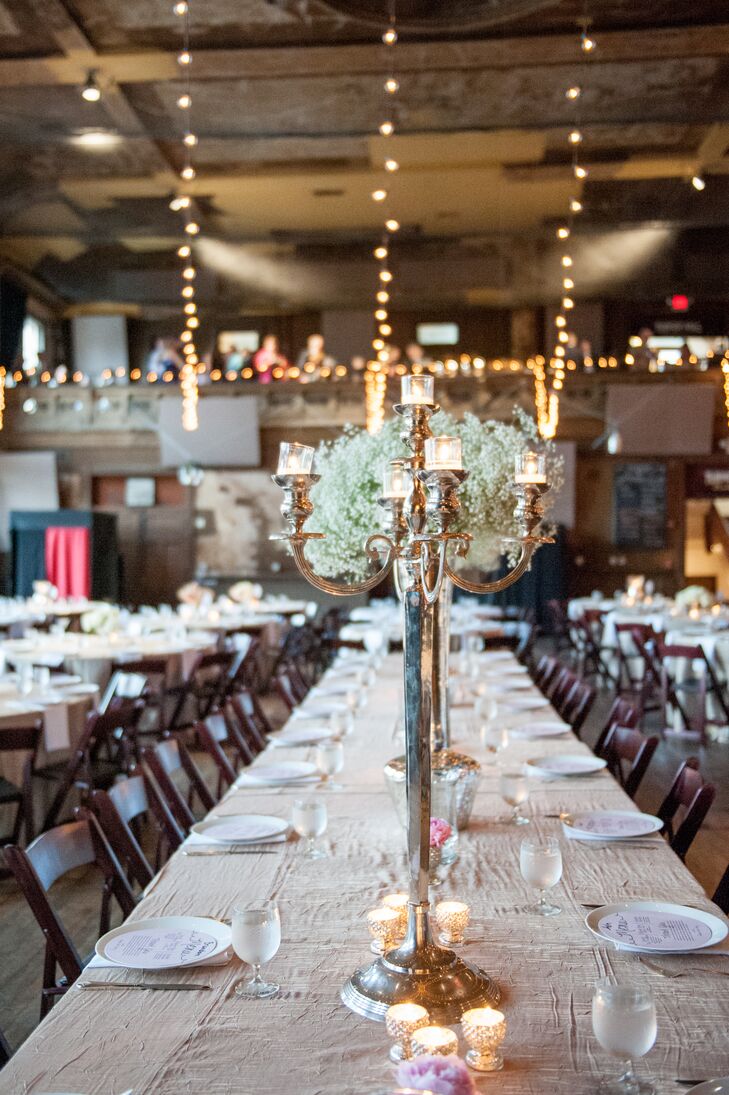 Tall candelabra and baby's breath arrangements added dimension to the reception decor.