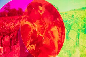 Couple Kissing Behind Neon Acrylic Sign