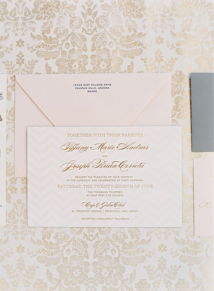 The couple’s custom stationery from Magnificent Milestones captured that classic feel Tiffany loves from “The Great Gatsby” with a little modern twist. Each name and location had a regal, gold-embossed script against—get this—a light gray and ivory chevron background. A blush envelope held it all together.