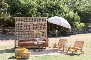 Lounge Vignette at Lawn Cocktail Hour With Umbrella, Couch, Lounge Chairs and Lemons