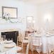 Gold chiavari chairs were used to play up the simplicity of the all-white room, where guests dined on watermelon and grapefruit mocktails during dinner.
