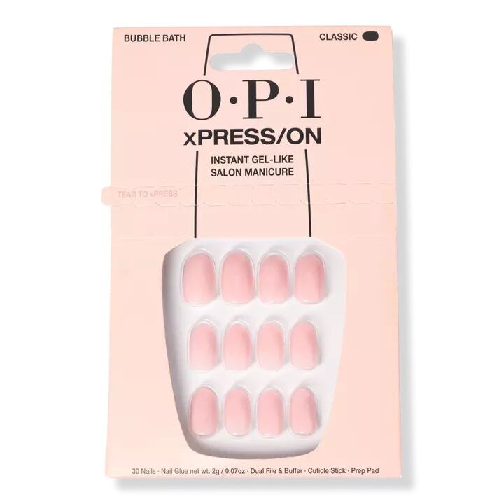 Rounded pink press on nails in a light pink box. 