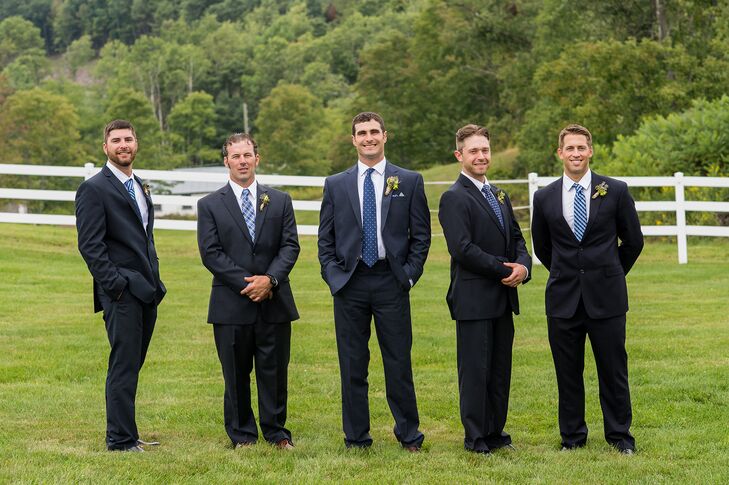 Groomsmen in Different Blue Ties and Navy Suits