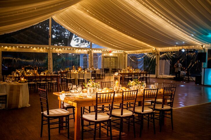 The reception was held under a permanent tent that featured windows allowing guests to enjoy beautiful views of the Delaware River. The tent's canopy twinkled with string lights that illuminated the farmhouse dining tables and brown chiavari chairs.