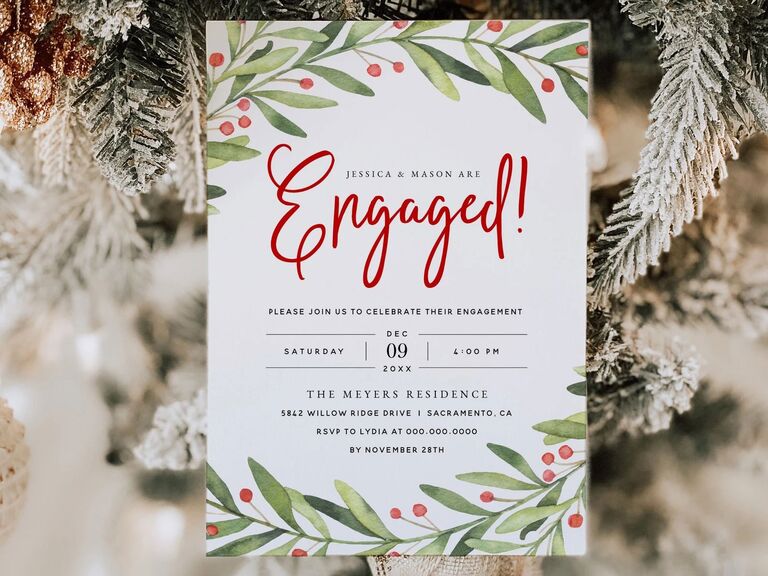 Digital engagement party invitation with a pine and red berry wreath