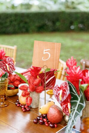 Wood Table Number Beside Tropical Centerpieces With Anthurium
