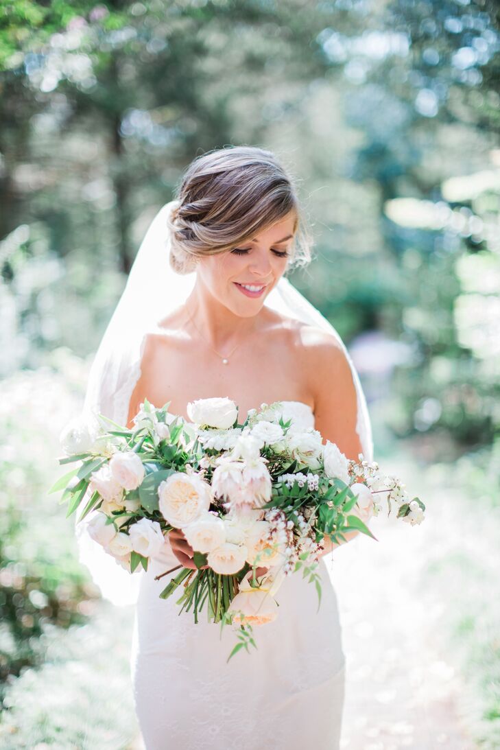 "To me, less is more," Allie Beth says. "I don't love frills or rhinestones. Simplicity is the way to go. Even though I could envision my overall look, I never expected to wear a mermaid-style dress. But when I tried on my gown at Winnie Couture, I knew immediately that this was it." My gown was fitted, with a sweetheart neckline, overlaid withrnsubtle lace and held together by satin buttons down its back. My veil was mid-length and edged in lace."