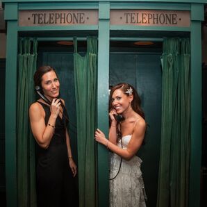 Brides in Different Outfits Posing in Retro, Vintage Telephone Booths at LGBTQ+ Wedding