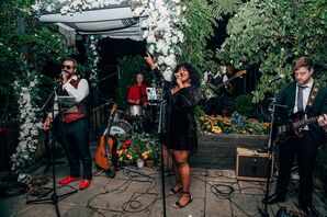 Band Performing at Rooftop Wedding Reception With Trees, Greenery and Floral Chuppah Backdrop