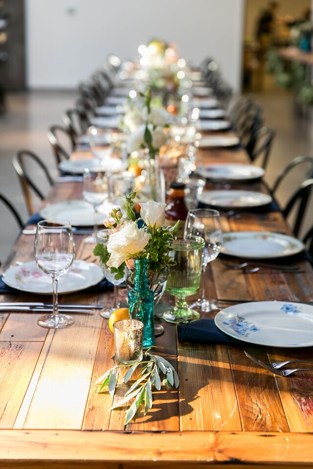 Place settings of beautiful mixed vintage china went well with the family-style meal at Ovation Chicago in Chicago, Illinois.
