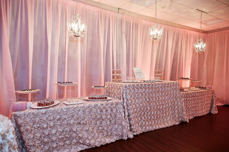 In addition to their nine-tier wedding cake, Maria and Chris enjoyed a dessert bar including a variety of macarons, cake pops, Rice Krispies treats, lemon tarts, salted-caramel brownies, chocolate mousse parfaits and chocolate-covered strawberries. The tables were draped with textured blush linens for added drama.