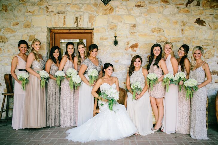 The bride wanted her bridesmaids to be able to express their individuality so she let them pick their dresses. She went with her sisters and Maid of Honor to choose a starting point and gave everyone a palette of light gold, blush and silver giving them free rein on length and embellishment design.