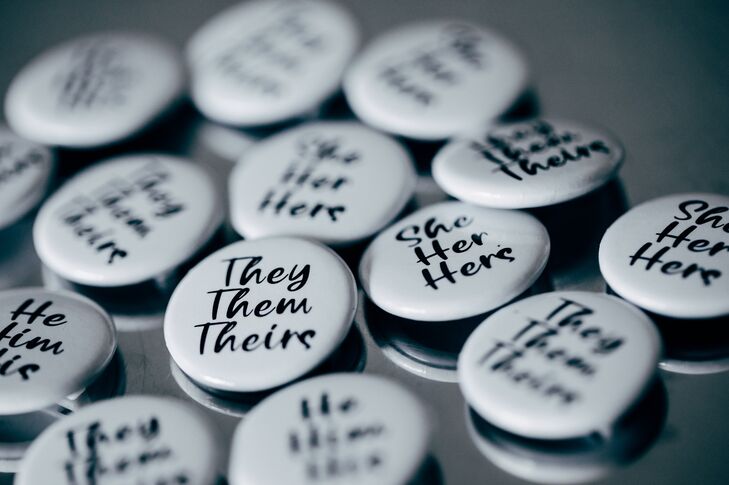 Personalized Buttons Featuring Various Pronoun Sets for Guests of LGBTQ+ Wedding