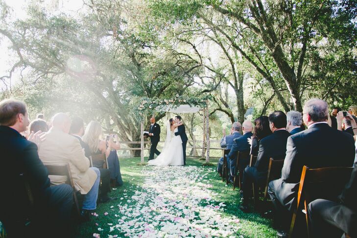 The couple kept the ceremony short, sweet and nondenominational, focusing on their story. Cara and Scott exchanged traditional vows under the shade of lush oak trees, sharing their handwritten letters. "Our personal letters of why we wanted to marry each other were my favorite part of the ceremony. They were heartfelt and had some funny little quirks in them, which I think really showed our families and friends who we are together," Cara says.