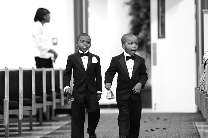 The two ring bearers walked down the aisle during the ceremony, wearing black tuxedos with matching black bow ties.